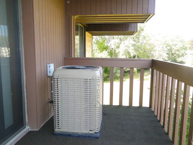 a view of wooden floor and a window