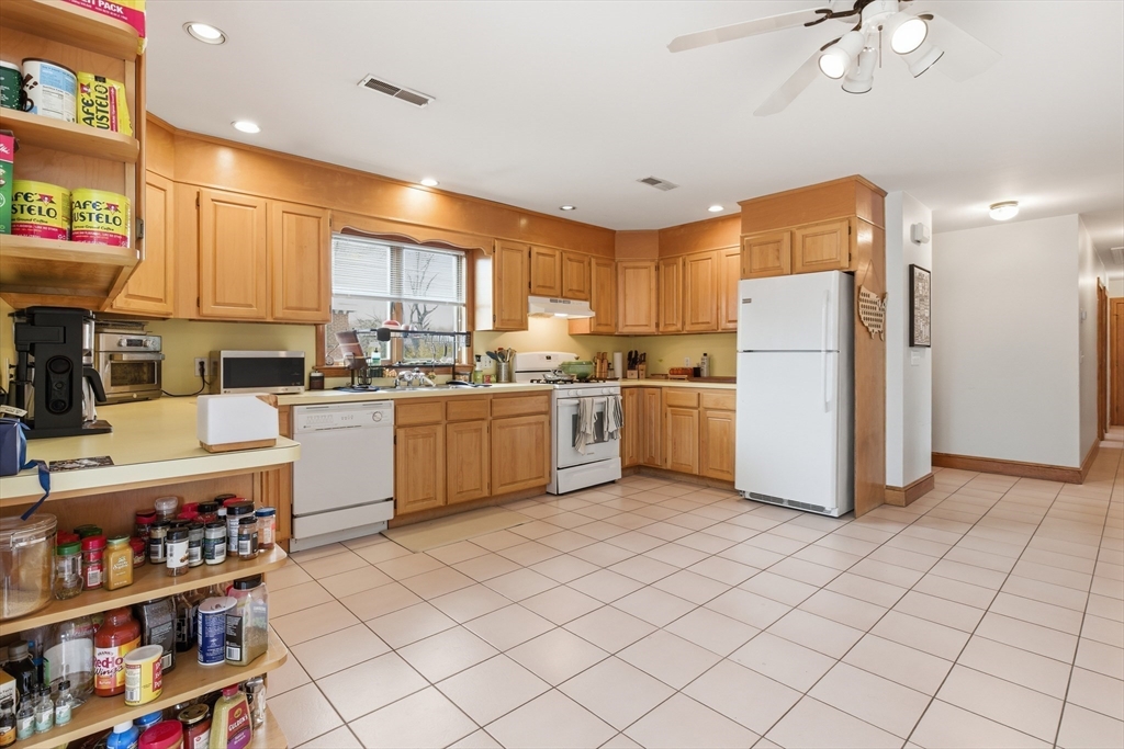 4-6 Jensen Road, Unit 6 Watertown, MA 02472 - Photo 7 of 23 a kitchen with a sink a refrigerator and cabinets