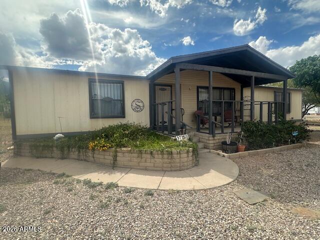 7258 South Lariat Road Hereford, AZ 85615 - Photo 1 of 37 a view of a house with a porch