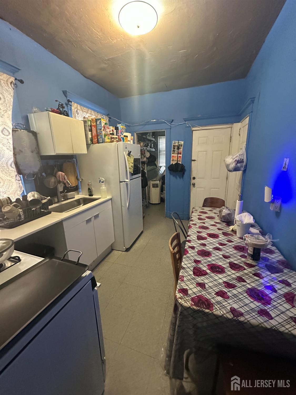 267 Handy Street New Brunswick, NJ 08901 - Photo 6 of 8 a bedroom with a bed and dresser