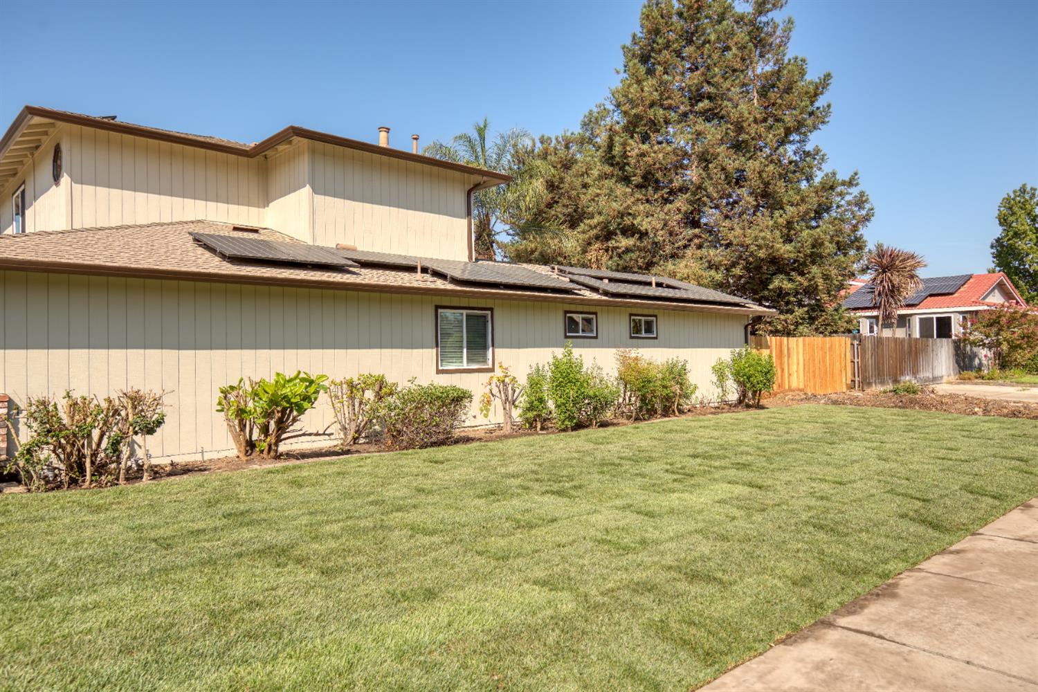 1621 Davis Street Ripon, CA 95366 - Photo 43 of 43 view of home's exterior with roof mounted solar panels and roof with shingles