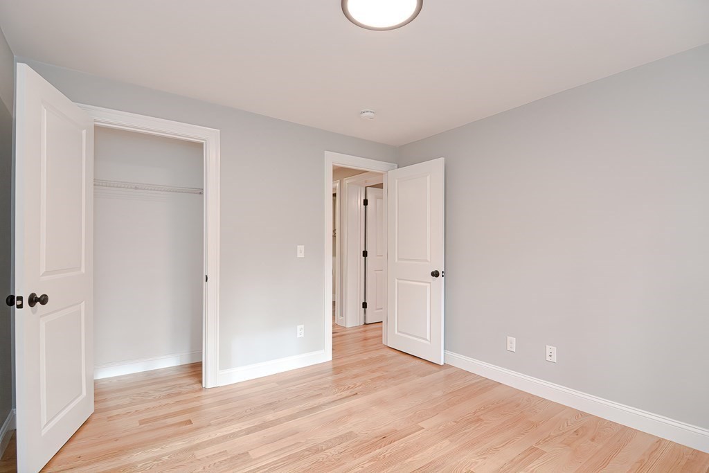 108 Olive Street Ashland, MA 01721 - Photo 11 of 34 a view of an empty room with wooden floor