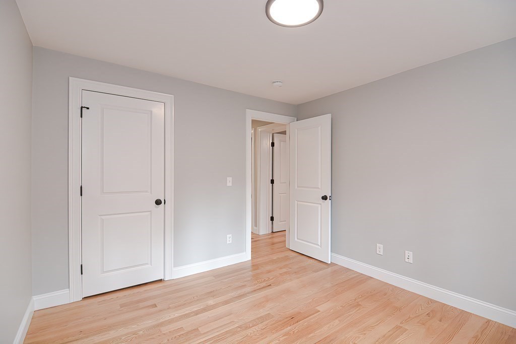 108 Olive Street Ashland, MA 01721 - Photo 18 of 34 a view of an empty room and wooden floor