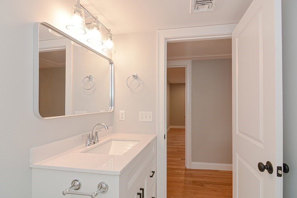 108 Olive Street Ashland, MA 01721 - Photo 20 of 34 a bathroom with a sink and a mirror