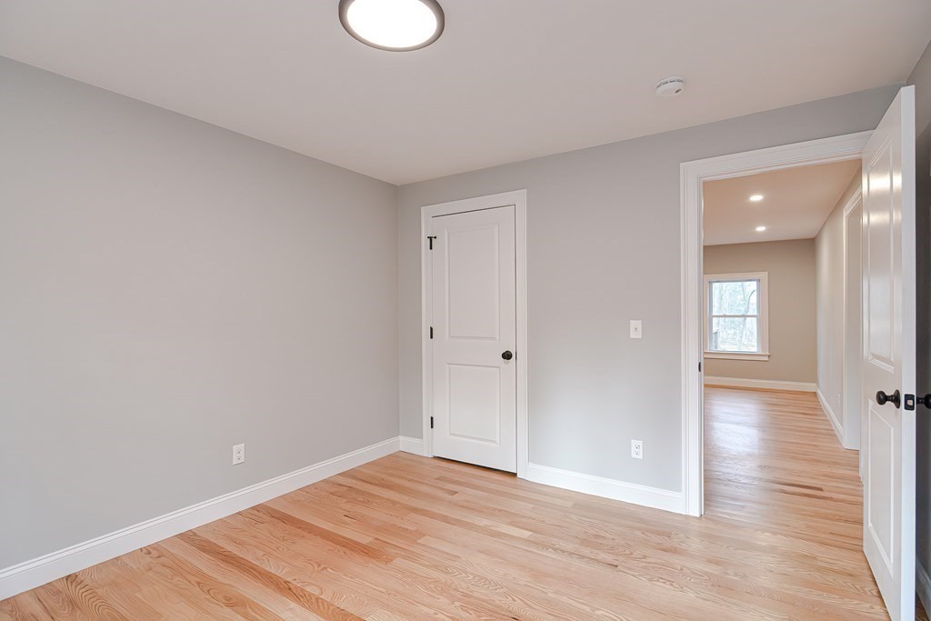 108 Olive Street Ashland, MA 01721 - Photo 21 of 34 a view of an empty room and wooden floor