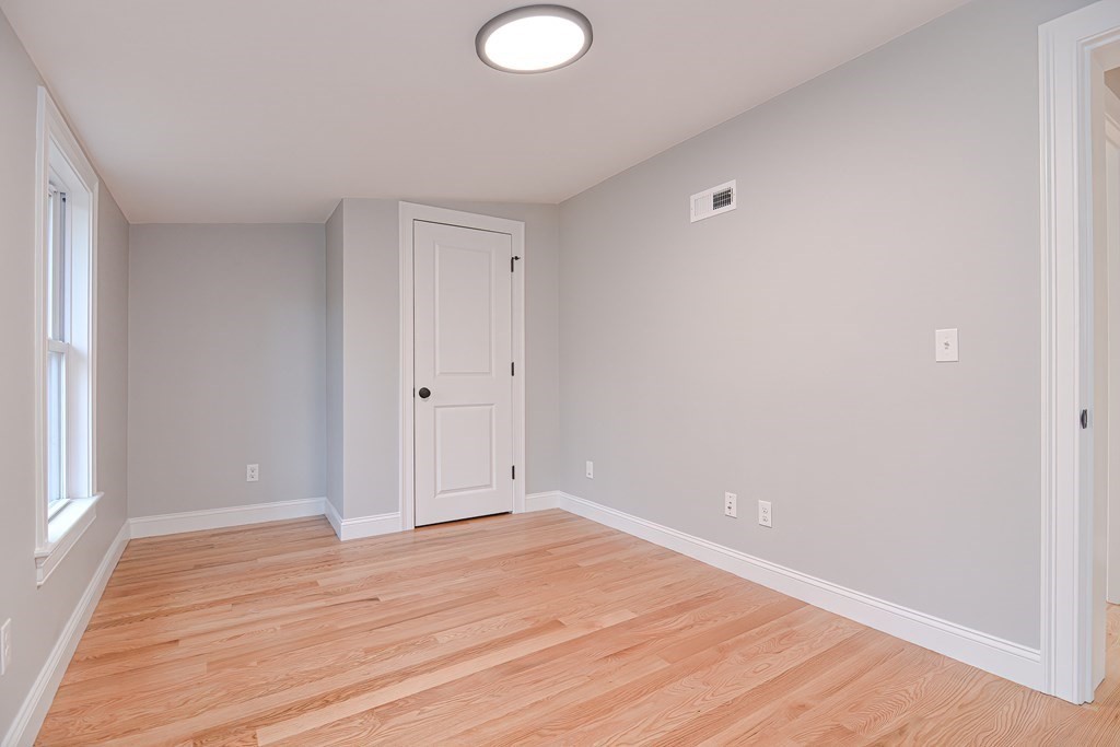 108 Olive Street Ashland, MA 01721 - Photo 26 of 34 wooden floor in an empty room