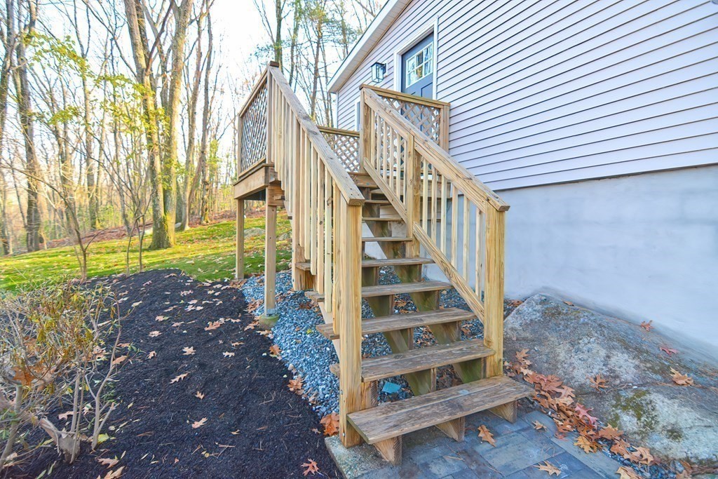 108 Olive Street Ashland, MA 01721 - Photo 28 of 34 a view of a pathway of a house with a yard