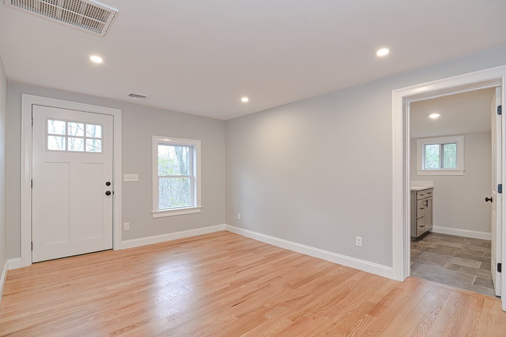 108 Olive Street Ashland, MA 01721 - Photo 7 of 34 an empty room with wooden floor and windows