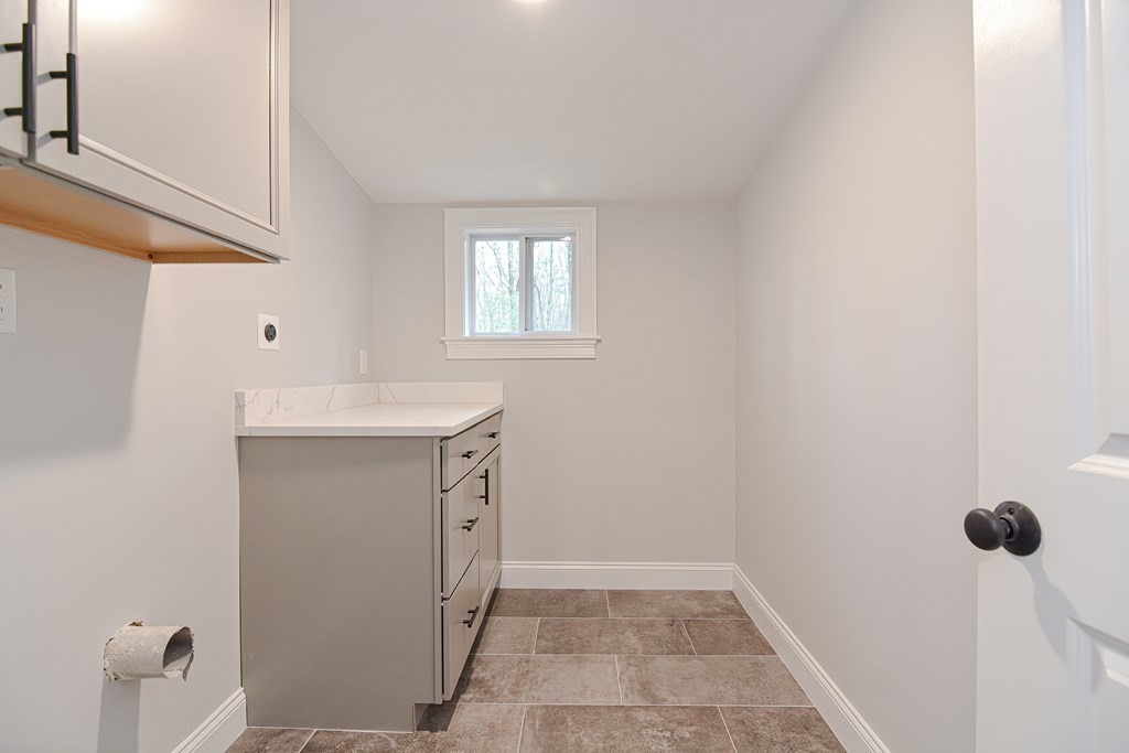 108 Olive Street Ashland, MA 01721 - Photo 8 of 34 a bathroom with a sink a toilet and shower