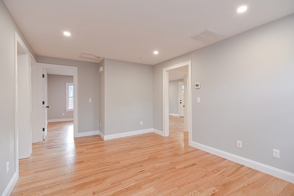 108 Olive Street Ashland, MA 01721 - Photo 10 of 34 wooden floor in an empty room with wooden floor