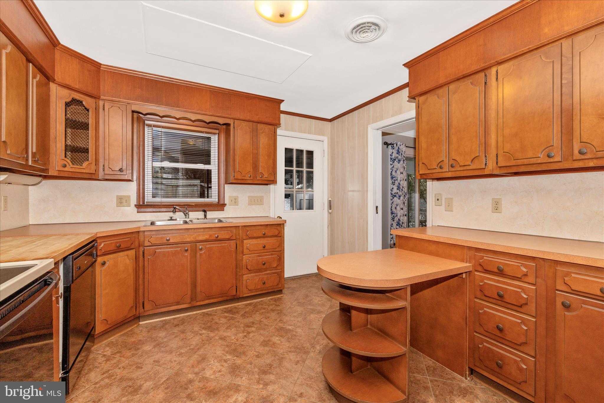 215 Broad Street Middletown, MD 21769 - Photo 14 of 56 a kitchen with a sink stove and cabinets