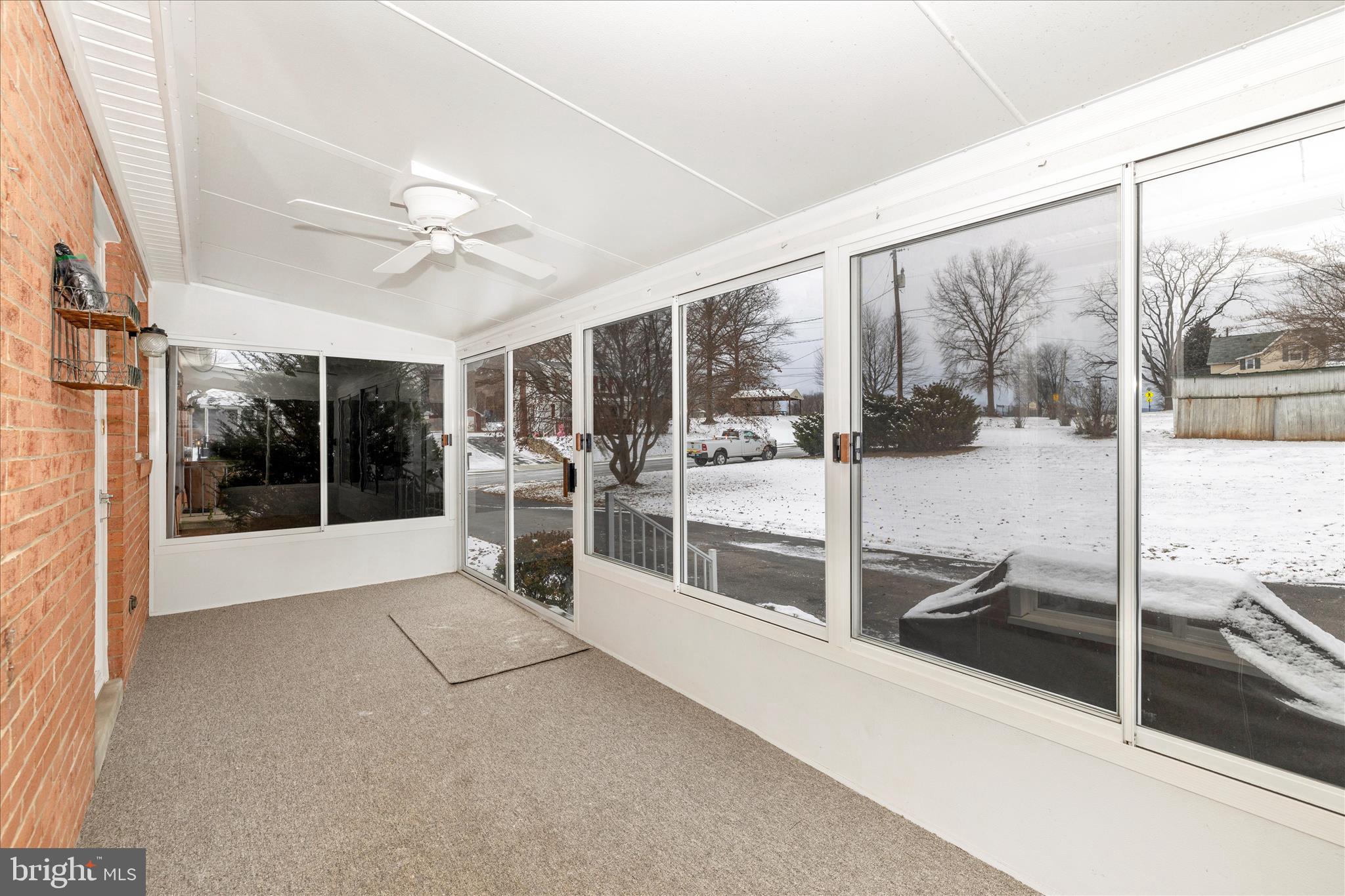 215 Broad Street Middletown, MD 21769 - Photo 17 of 56 a view of a hall with wooden floor and a floor to ceiling window