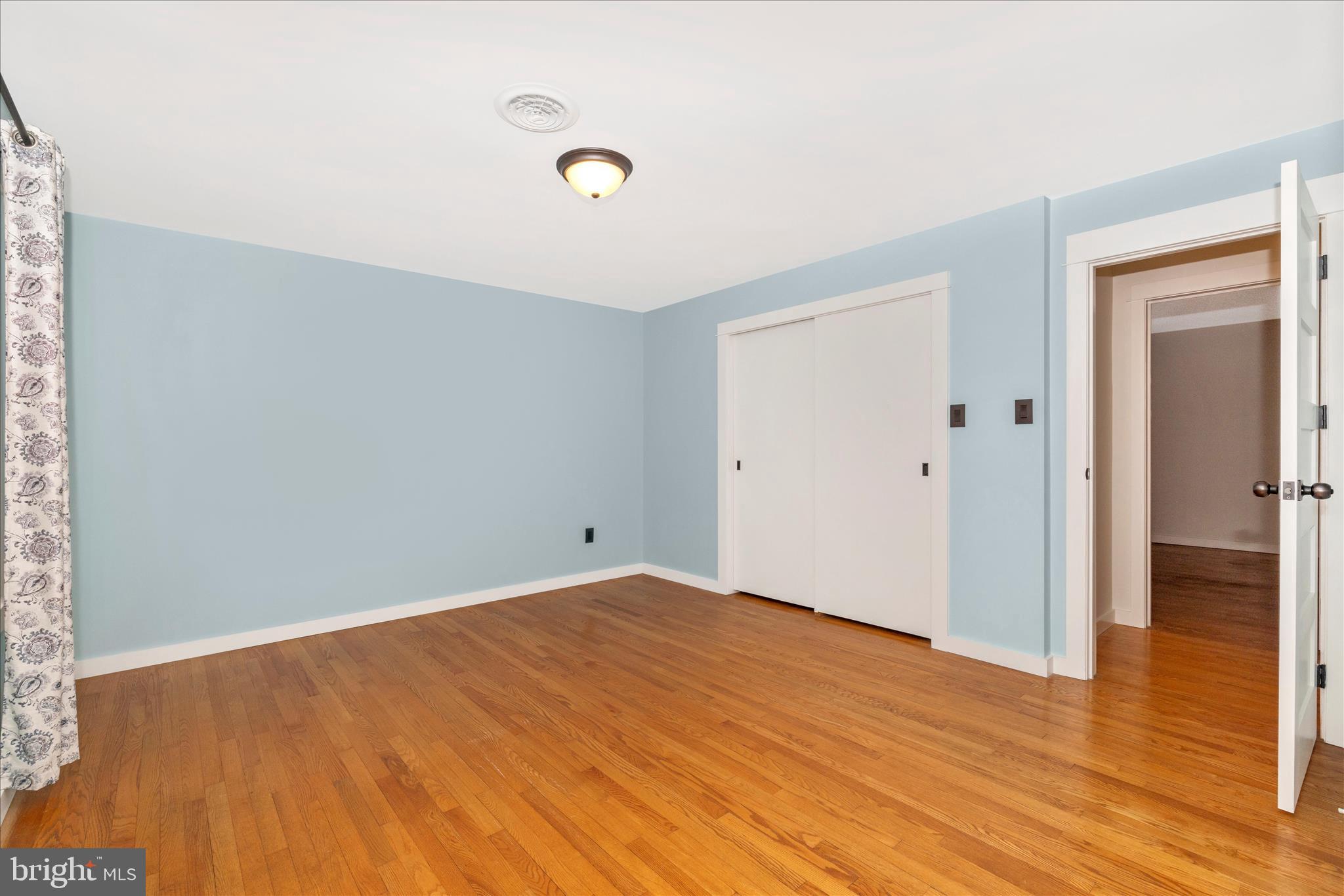 215 Broad Street Middletown, MD 21769 - Photo 21 of 56 a view of empty room with wooden floor