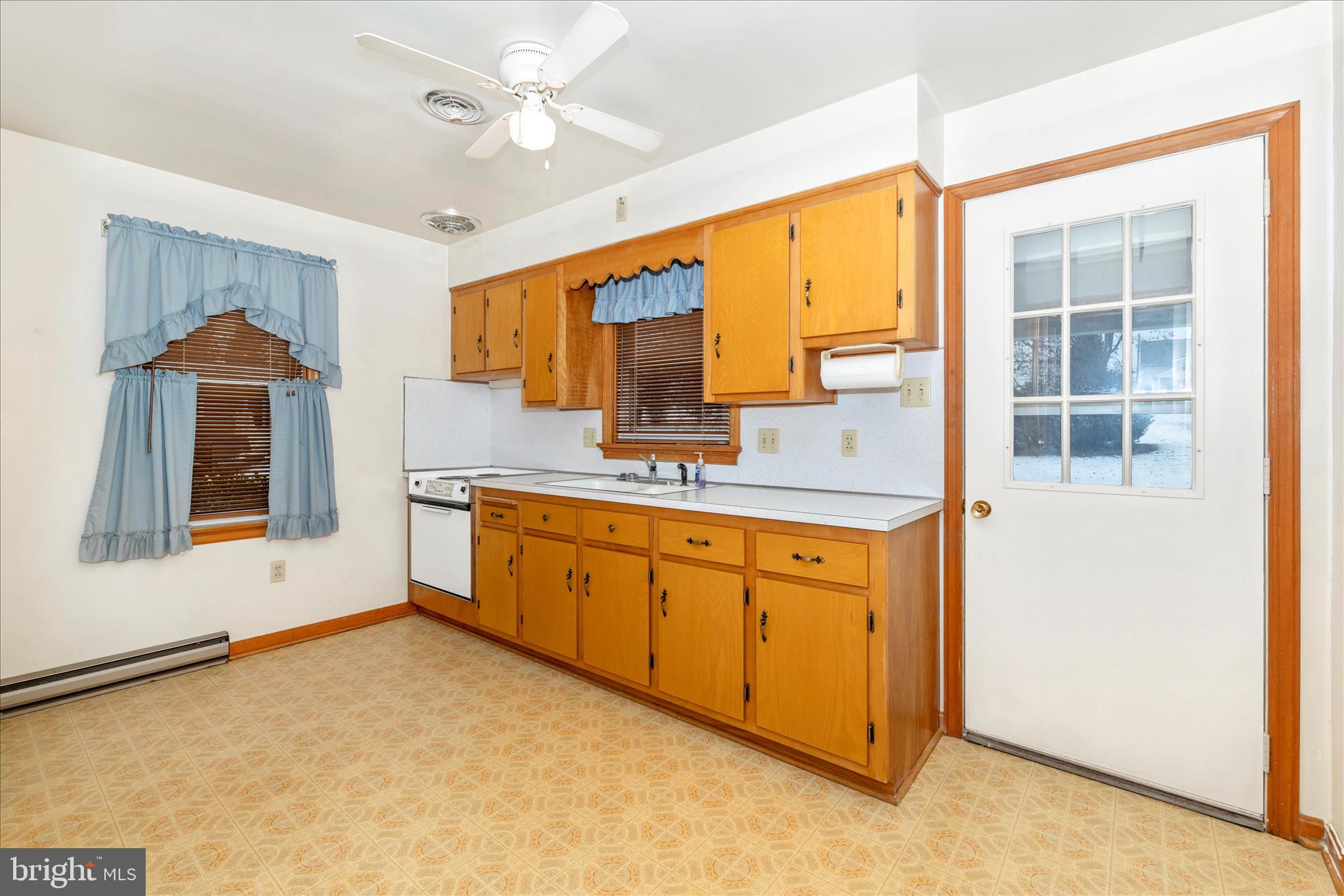 215 Broad Street Middletown, MD 21769 - Photo 31 of 56 a spacious bathroom with a granite countertop sink and a mirror