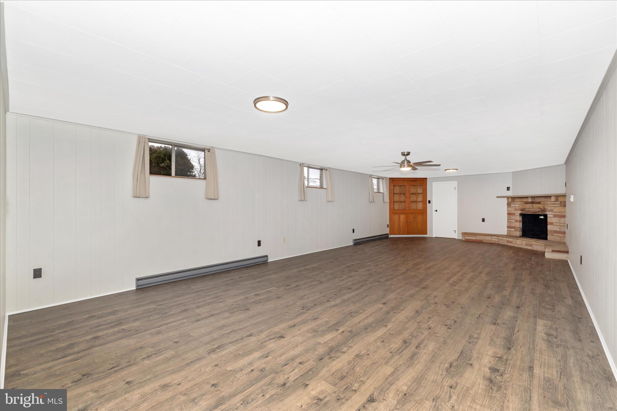 215 Broad Street Middletown, MD 21769 - Photo 35 of 56 a view of a livingroom with wooden floor and a window