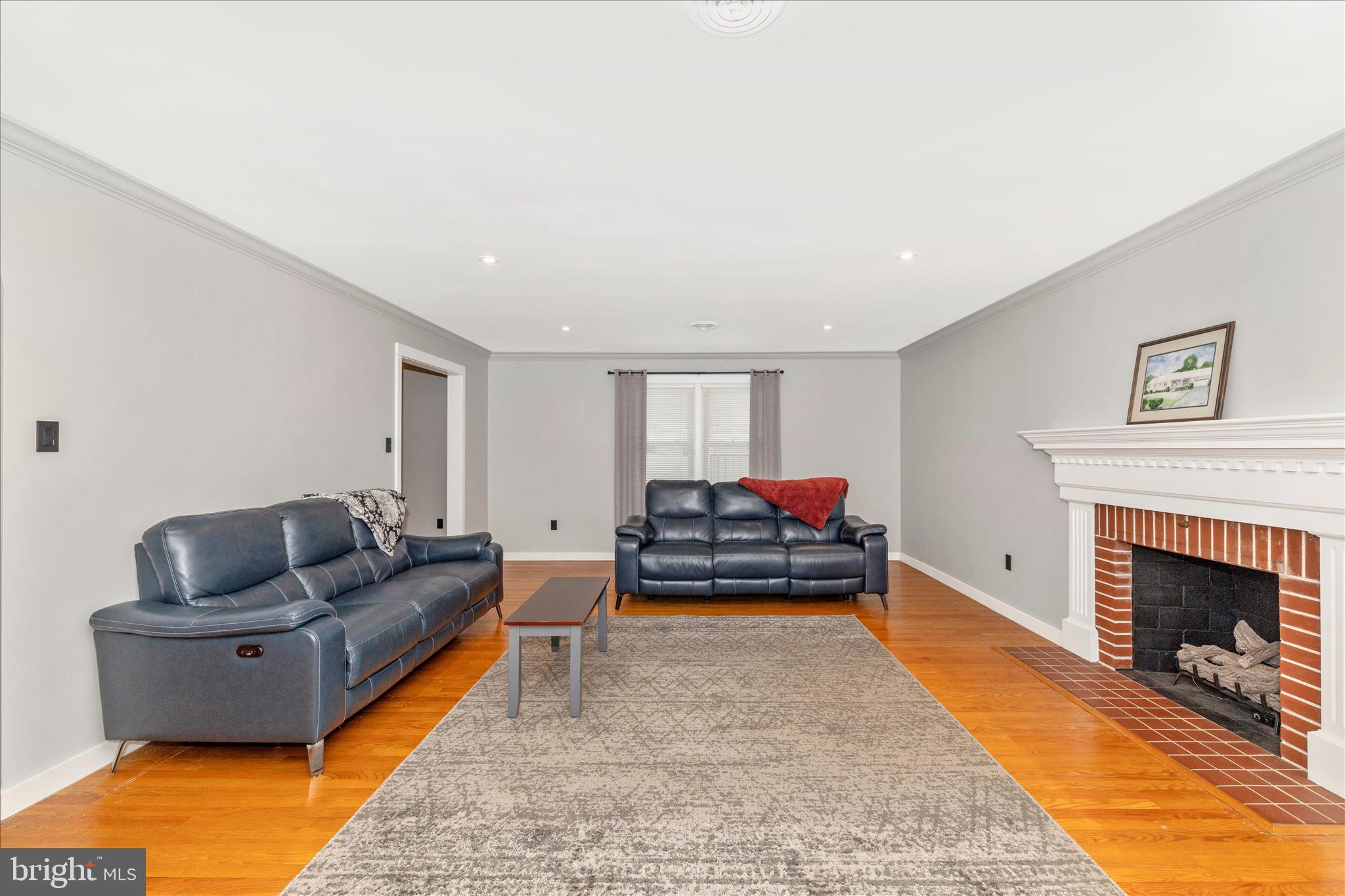 215 Broad Street Middletown, MD 21769 - Photo 6 of 56 a living room with furniture and a fireplace