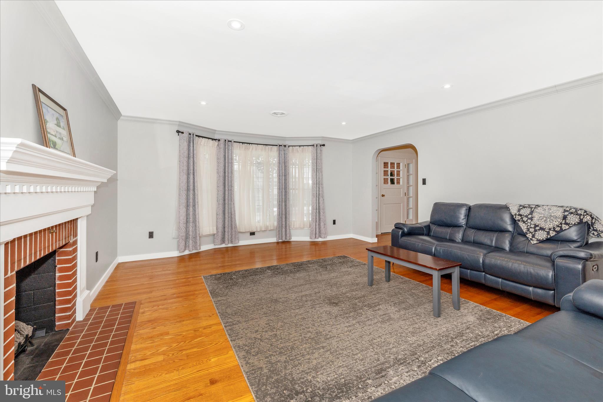 215 Broad Street Middletown, MD 21769 - Photo 9 of 56 a living room with furniture and a fireplace