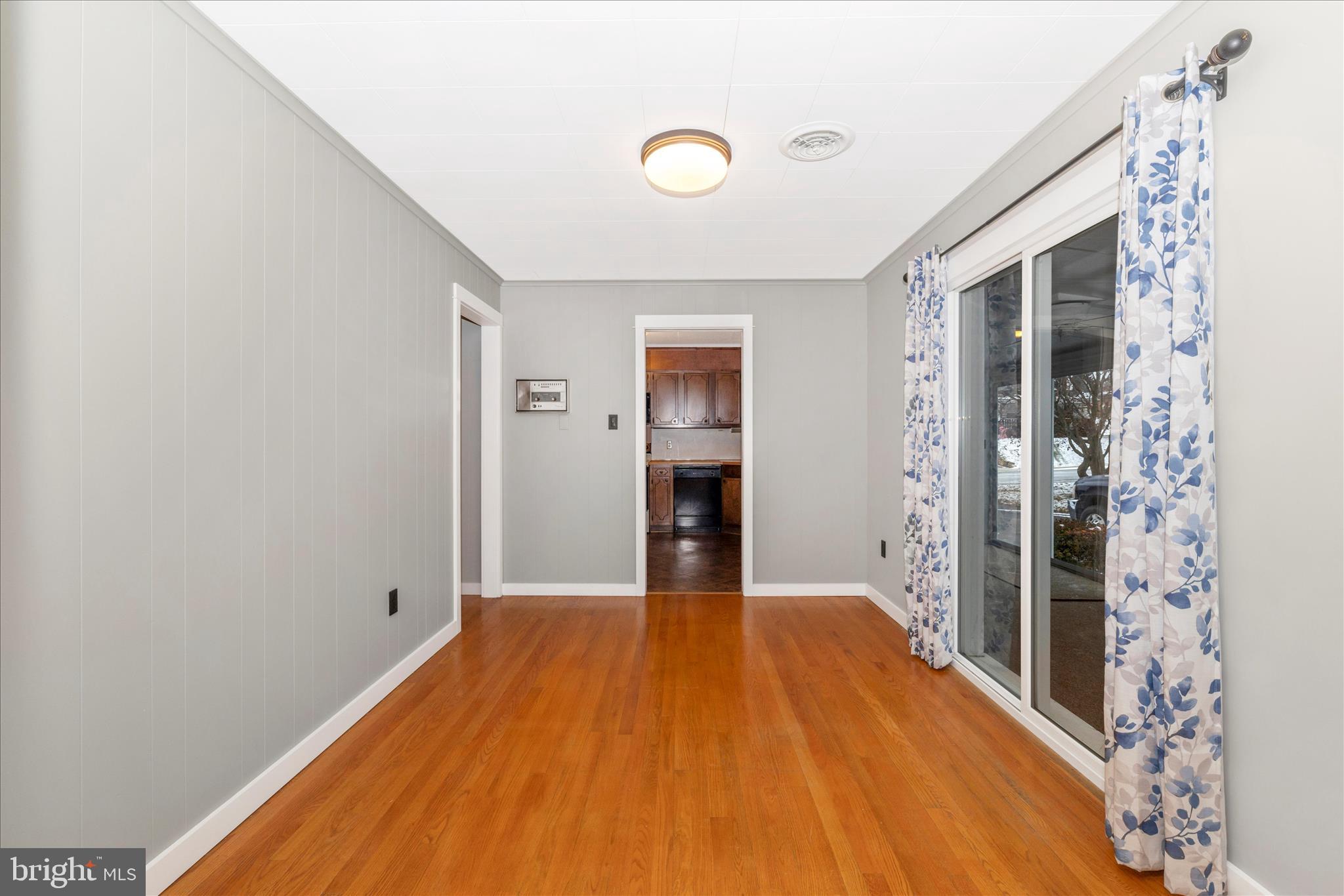 215 Broad Street Middletown, MD 21769 - Photo 10 of 56 a bedroom with a bed and a chandelier