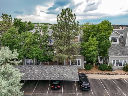 an aerial view of a house with a big yard