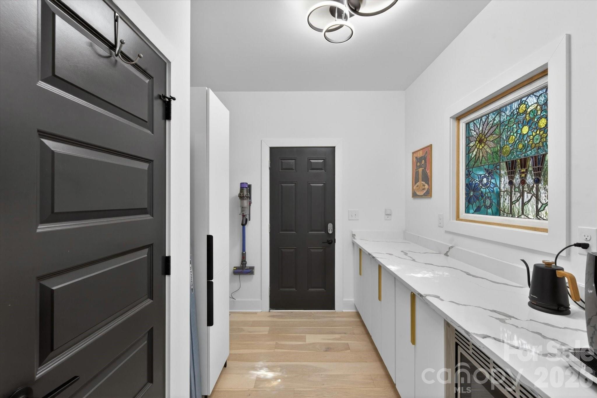 1608 Chippendale Road Charlotte, NC 28205 - Photo 29 of 46 a bathroom with a granite countertop sink and a window