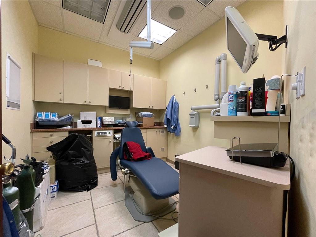 655 76th Street Brooklyn, NY 11209 - Photo 11 of 30 a kitchen with stainless steel appliances a stove a sink a refrigerator a microwave and cabinets