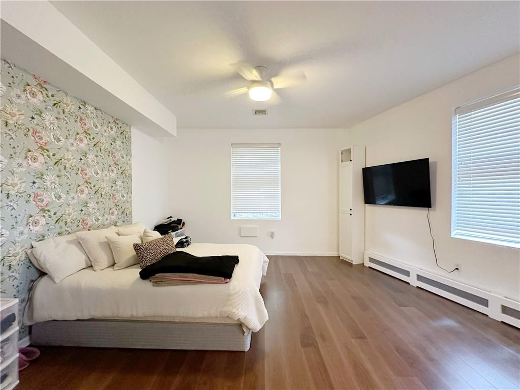 655 76th Street Brooklyn, NY 11209 - Photo 23 of 30 a living room with furniture and a flat screen tv
