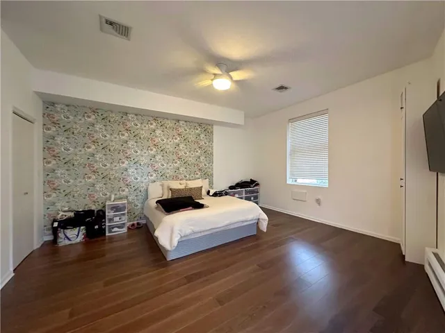 a kitchen with a sink appliances and cabinets