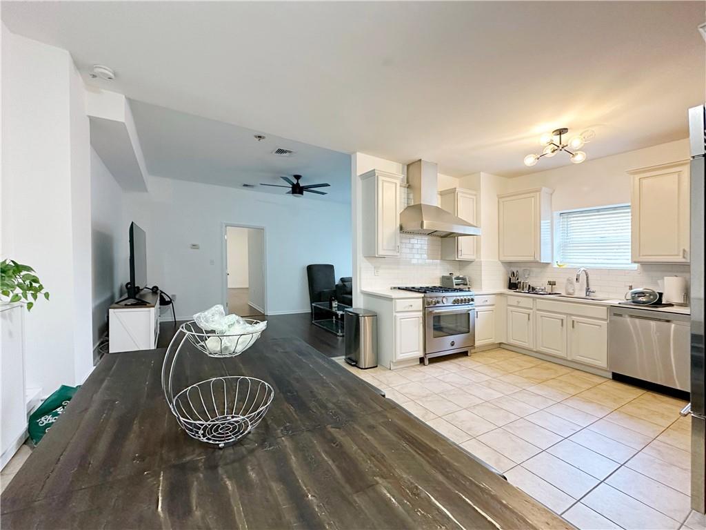 655 76th Street Brooklyn, NY 11209 - Photo 26 of 30 a kitchen with a sink appliances and cabinets