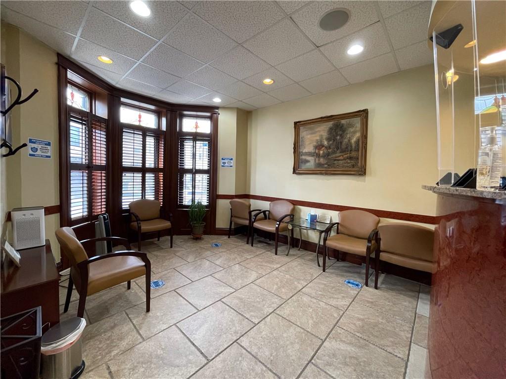 655 76th Street Brooklyn, NY 11209 - Photo 3 of 30 a living room with furniture and a window