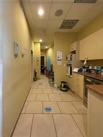 a kitchen with stainless steel appliances a refrigerator and cabinets