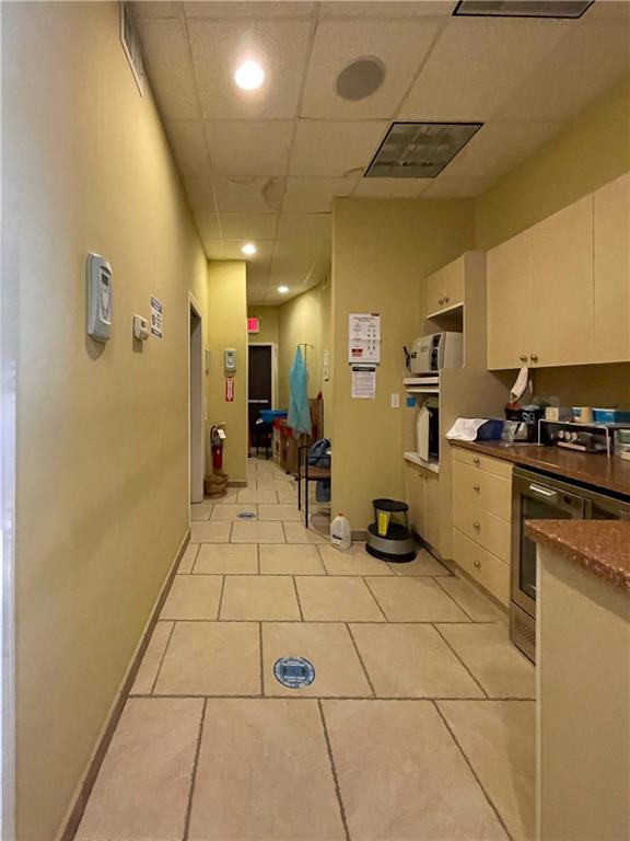 655 76th Street Brooklyn, NY 11209 - Photo 7 of 30 a kitchen with stainless steel appliances a refrigerator and cabinets