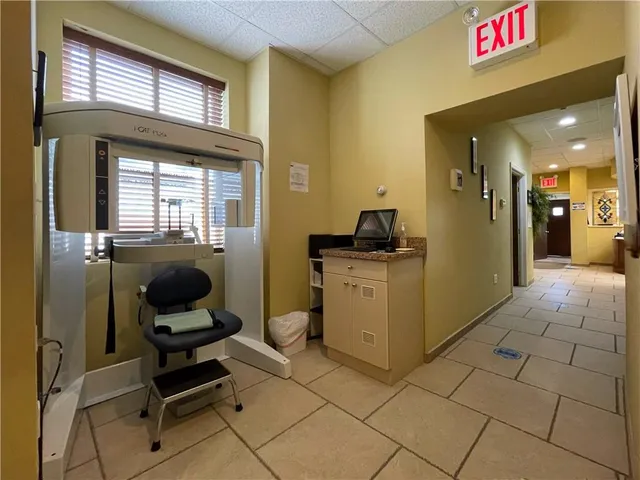 a kitchen with a sink and a refrigerator
