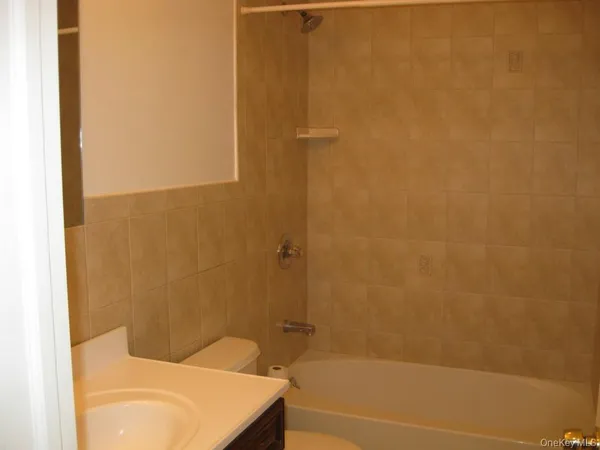 a bathroom with a shower and a toilet