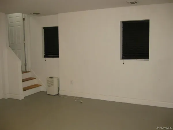 a bathroom with a sink toilet and a mirror