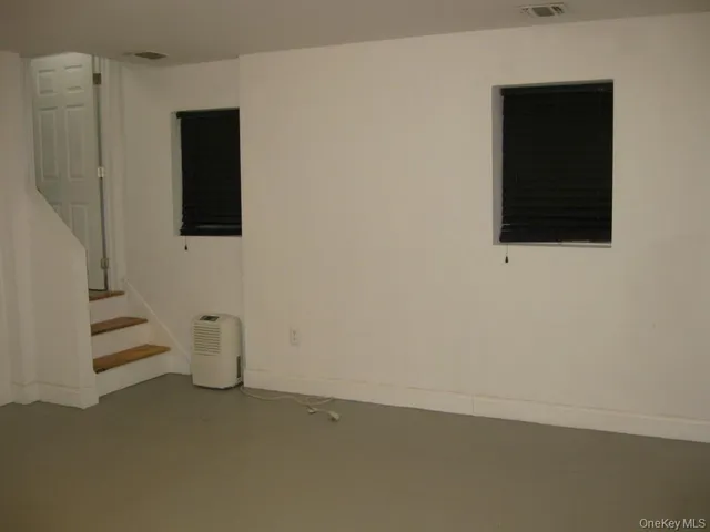 a bathroom with a sink toilet and a mirror