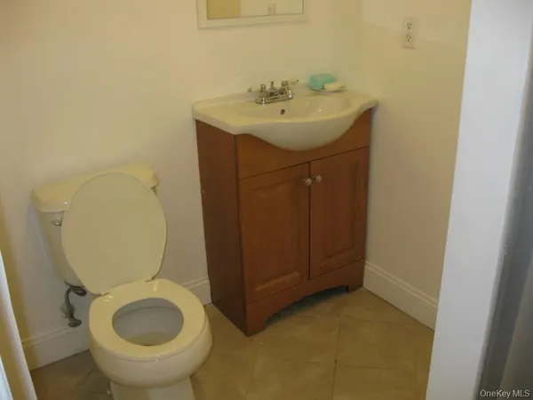 a utility room with sink dryer and washer