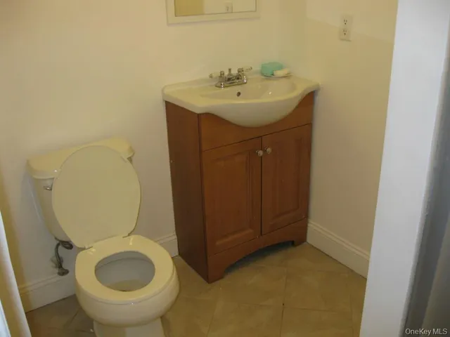 a utility room with sink dryer and washer