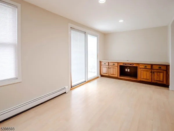 an empty room with furniture