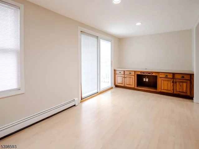 an empty room with furniture