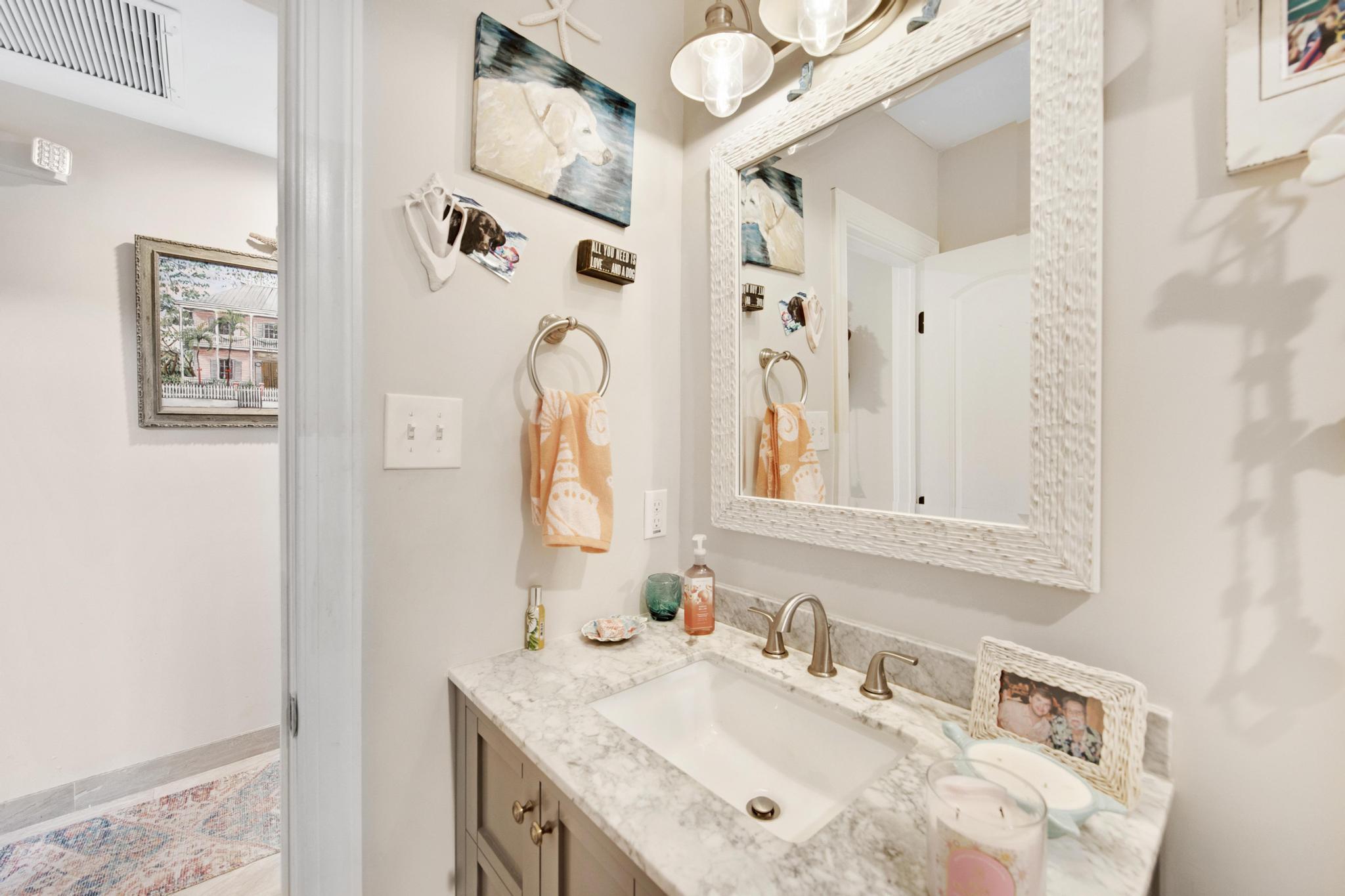 351 8th Street Key Colony Beach, FL 33051 - Photo 13 of 38 a bathroom with a granite countertop sink and a mirror