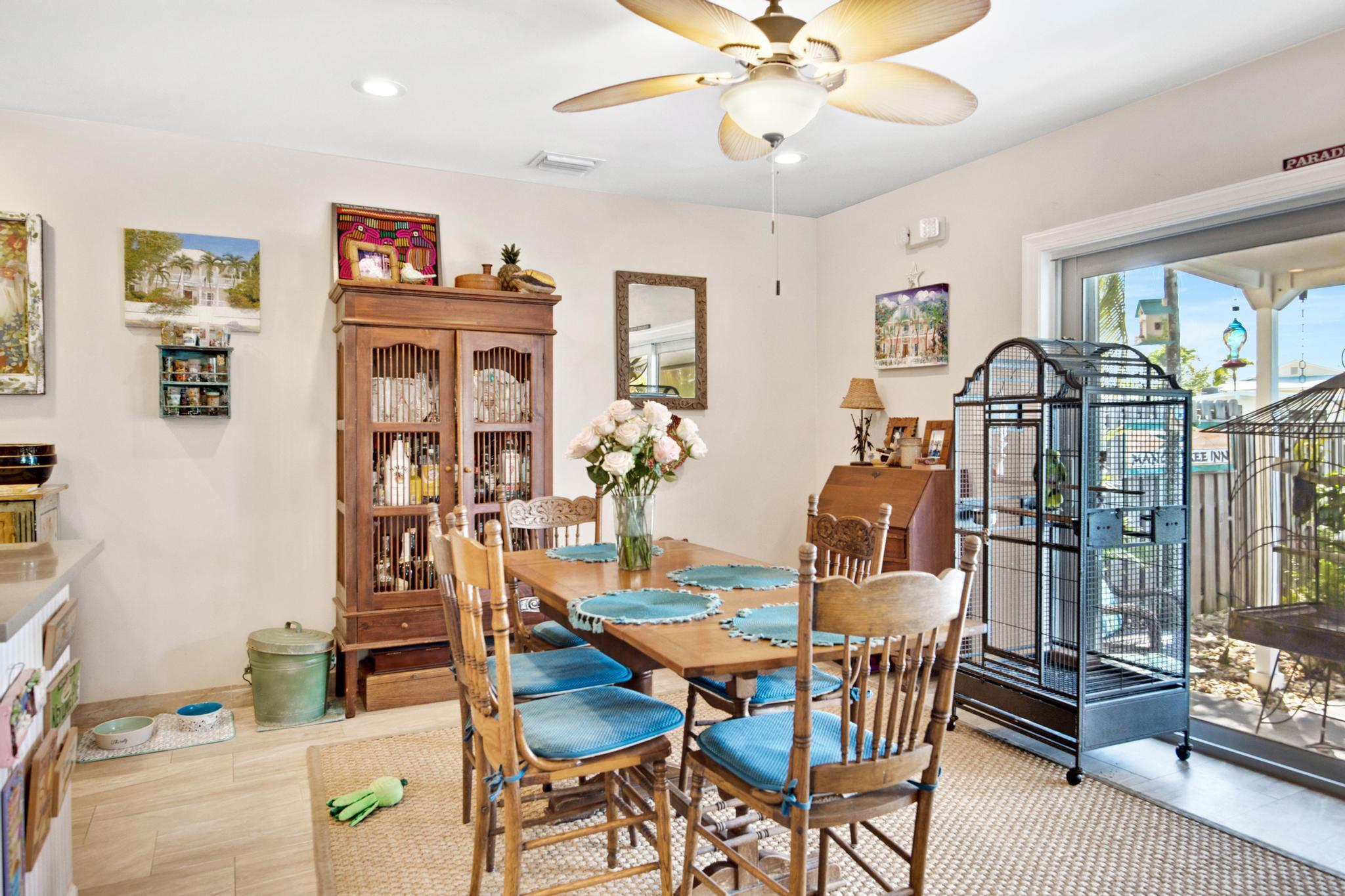 351 8th Street Key Colony Beach, FL 33051 - Photo 10 of 38 a view of a dining room with furniture and a chandelier