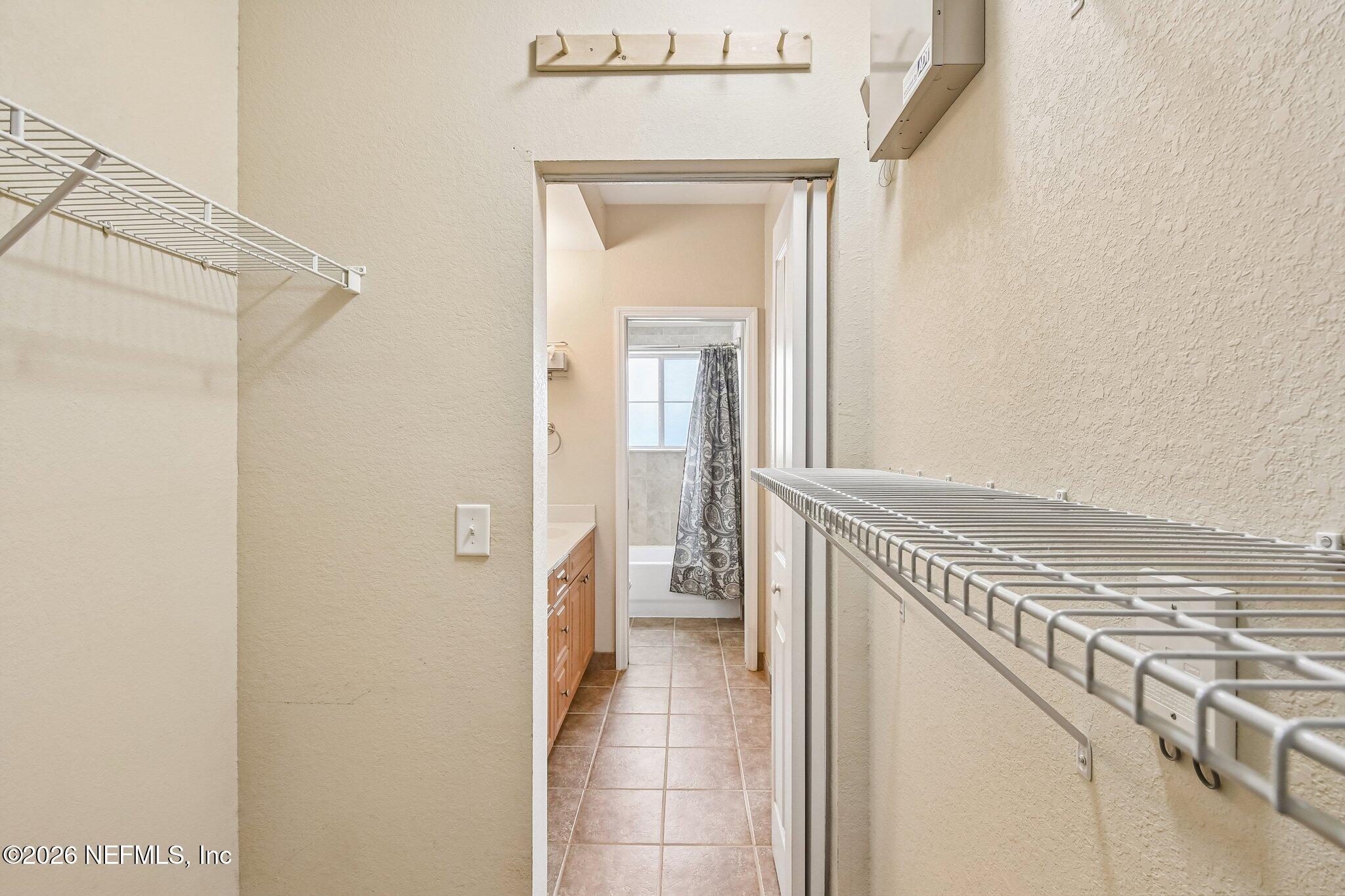 9745 Touchton Road, Unit 1129 Jacksonville, FL 32246 - Photo 30 of 57 Primary BR Walk-In Closet 2nd View
