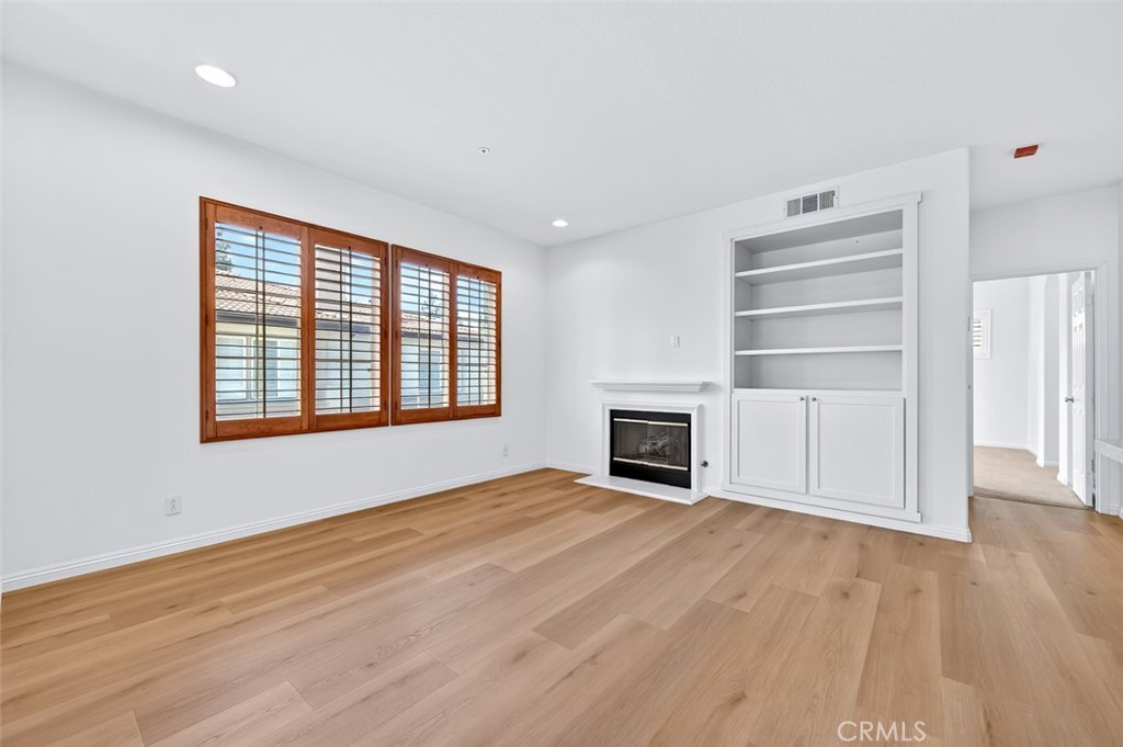 447 Ridgeway Irvine, CA 92620 - Photo 53 of 88 a view of an empty room with a fireplace and a window