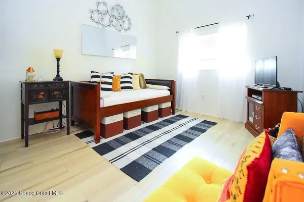 a bed room with a bed and a lamp