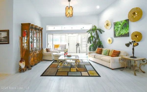 a living room with furniture and a table