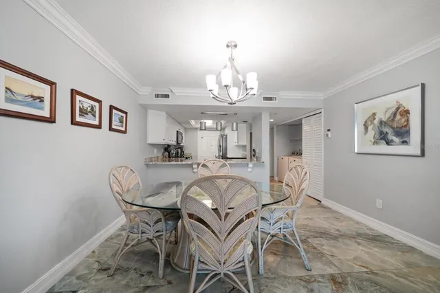 a view of a house with yard and plants in front of it