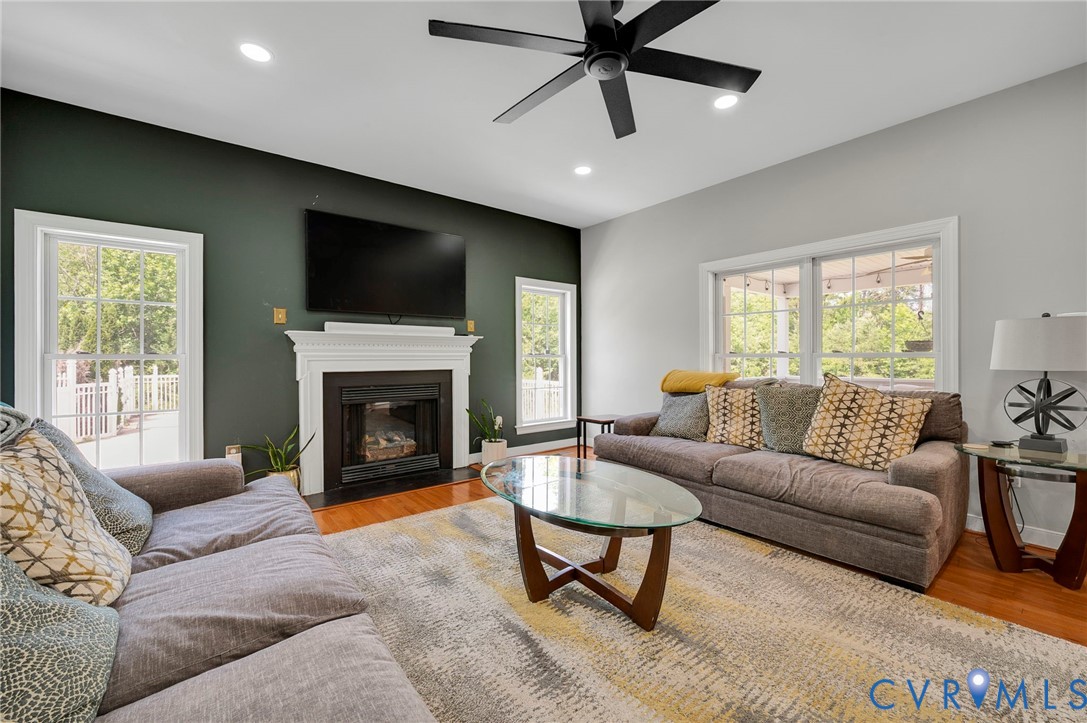 3090 Poor House Road Goochland, VA 23063 - Photo 10 of 32 Living area featuring hardwood flooring, a firepla