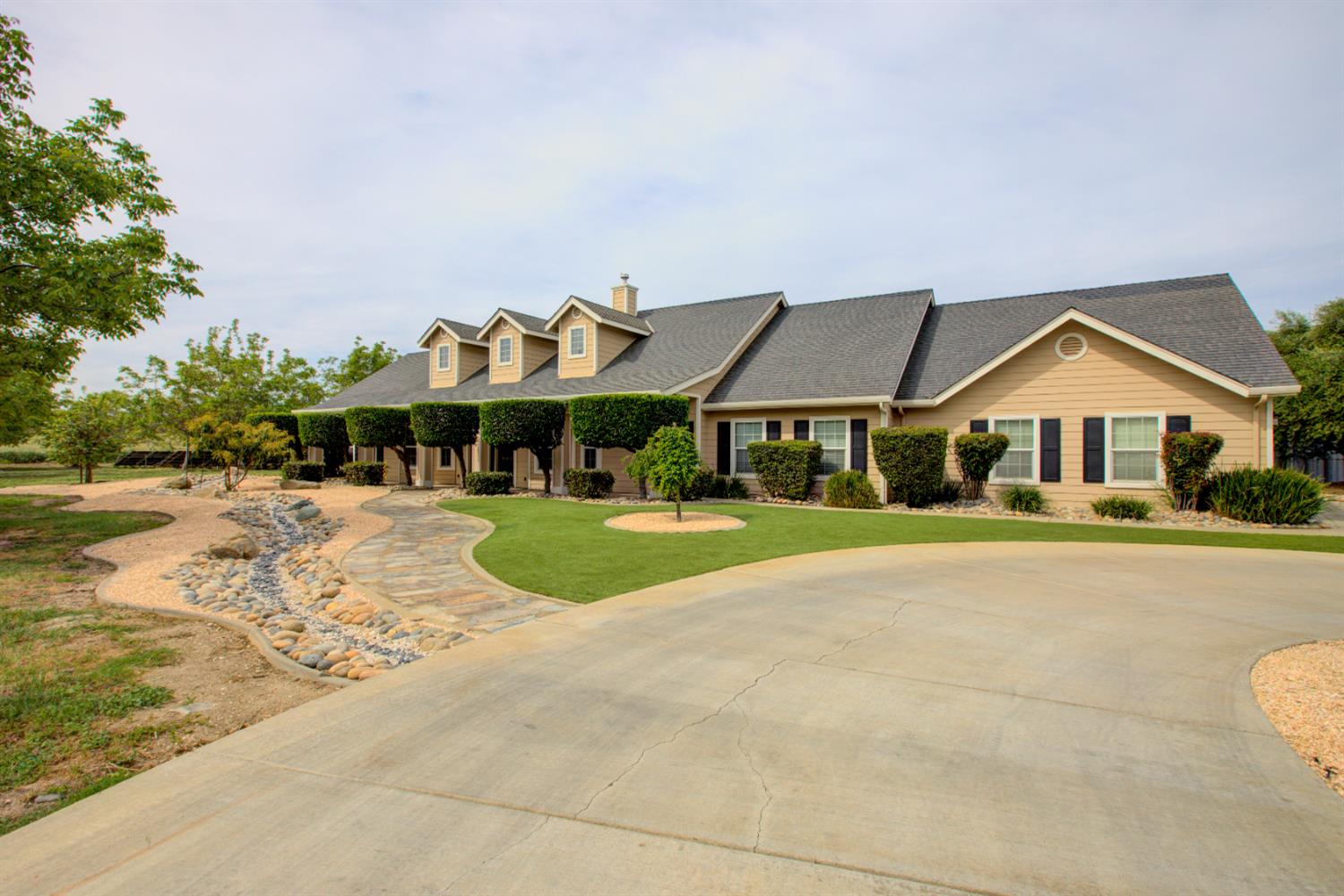 1054 Townhill Road Oakdale, CA 95361 - Photo 1 of 60 a front view of house with yard and green space