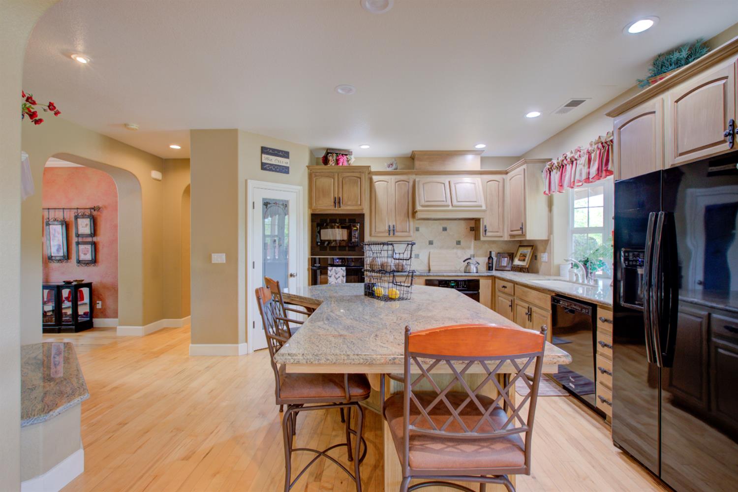 1054 Townhill Road Oakdale, CA 95361 - Photo 11 of 60 a kitchen with a table and chairs in it