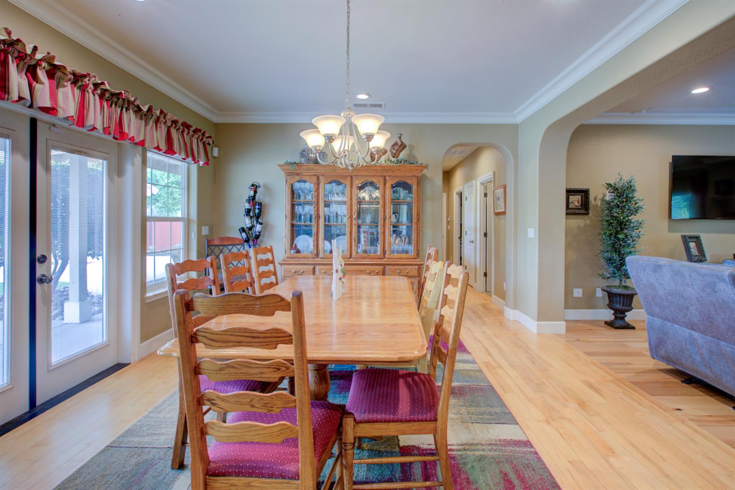 1054 Townhill Road Oakdale, CA 95361 - Photo 12 of 60 a view of a dining room with furniture and wooden floor